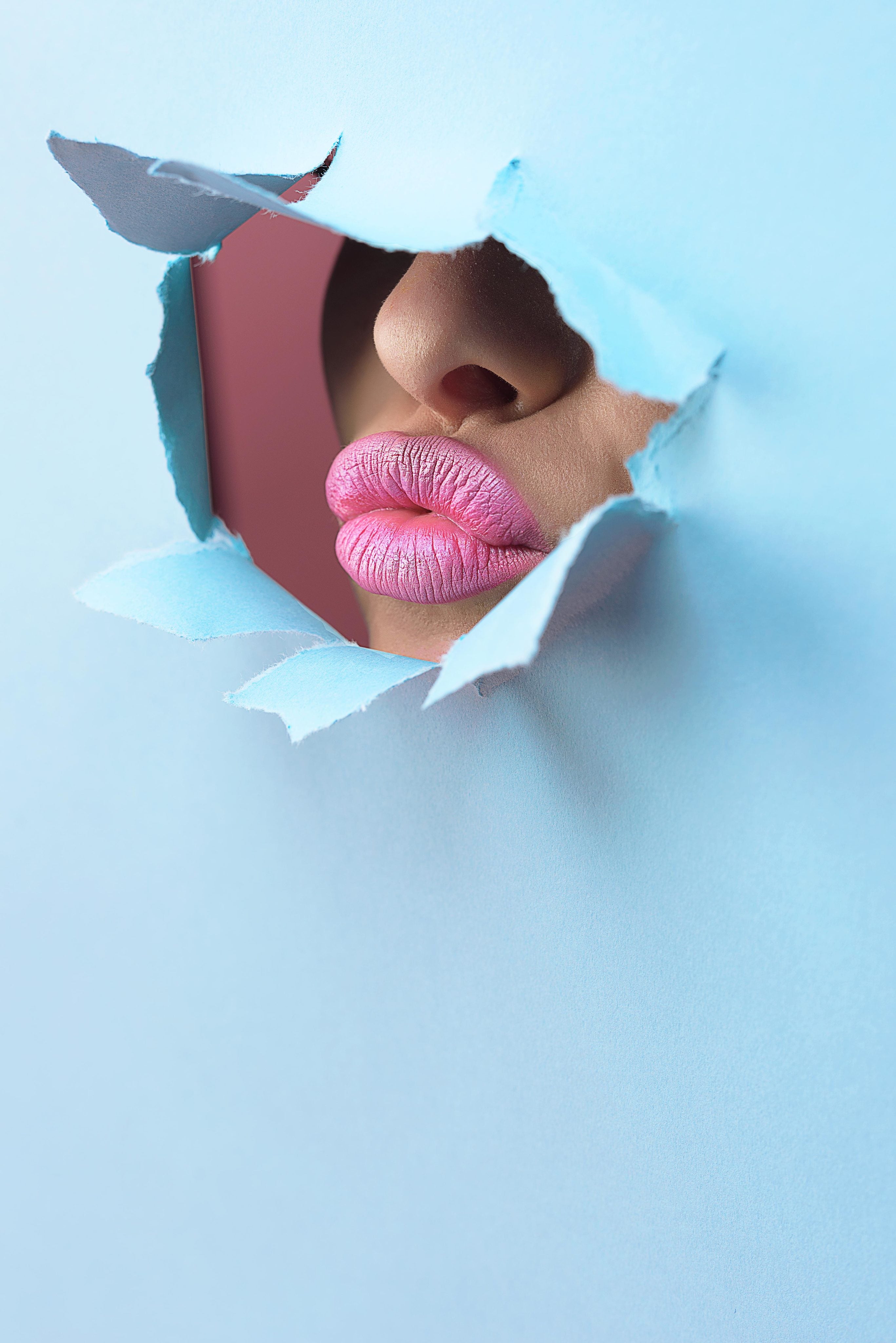 pink-lipstick-through-bright-blue-paper.jpg